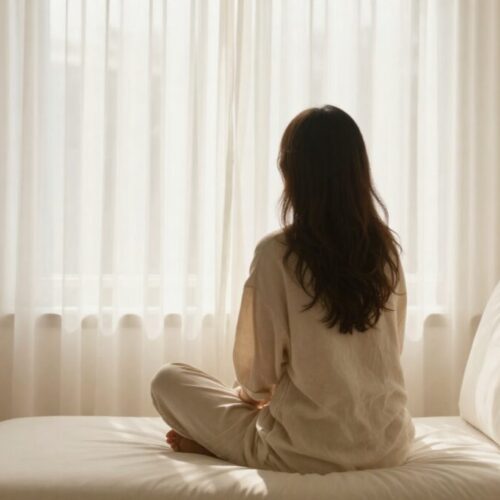 A woman looking out the window- tired of people pleasing